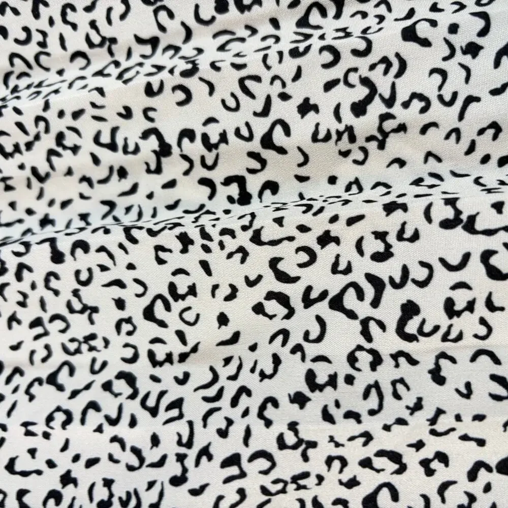 Girls White leopard print wide leg flowy pants. Size 11-12y. animal print, boho